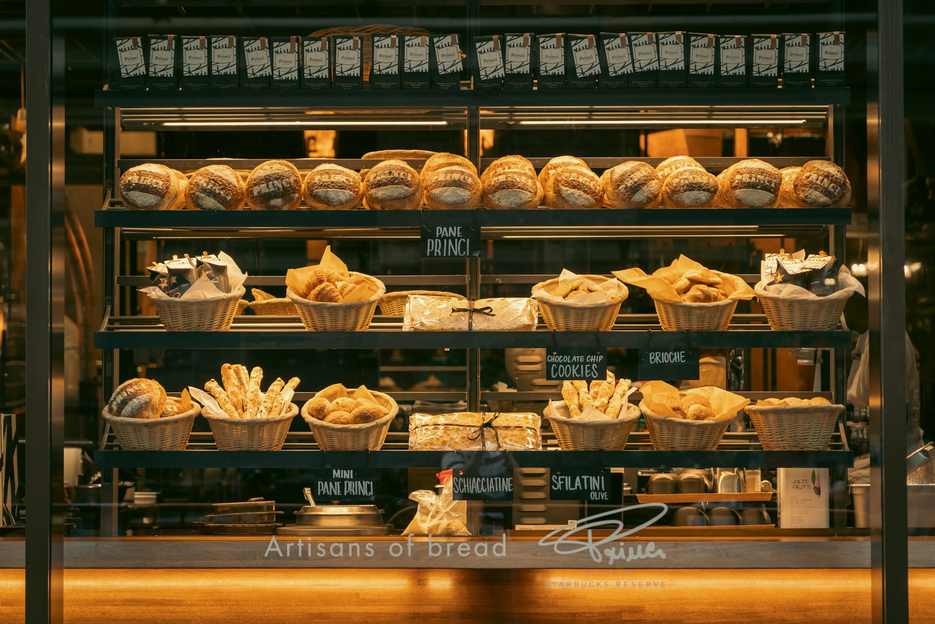 a bakery filled with lots of different types of bread